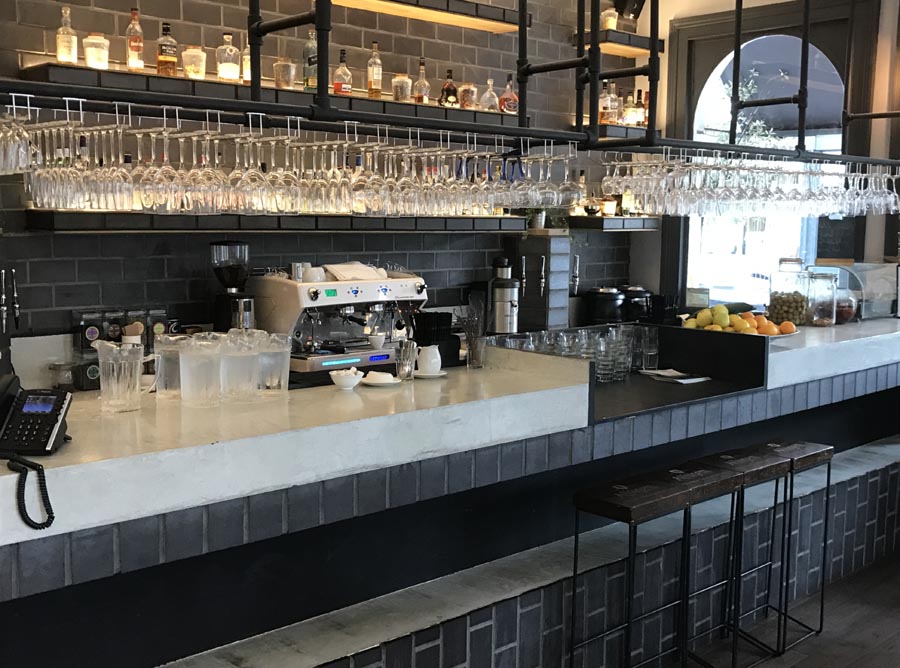 Ketley staffs blue quarry tiles line the wall and the bar in this gorgeous new space at Chelseas Imperial Pub